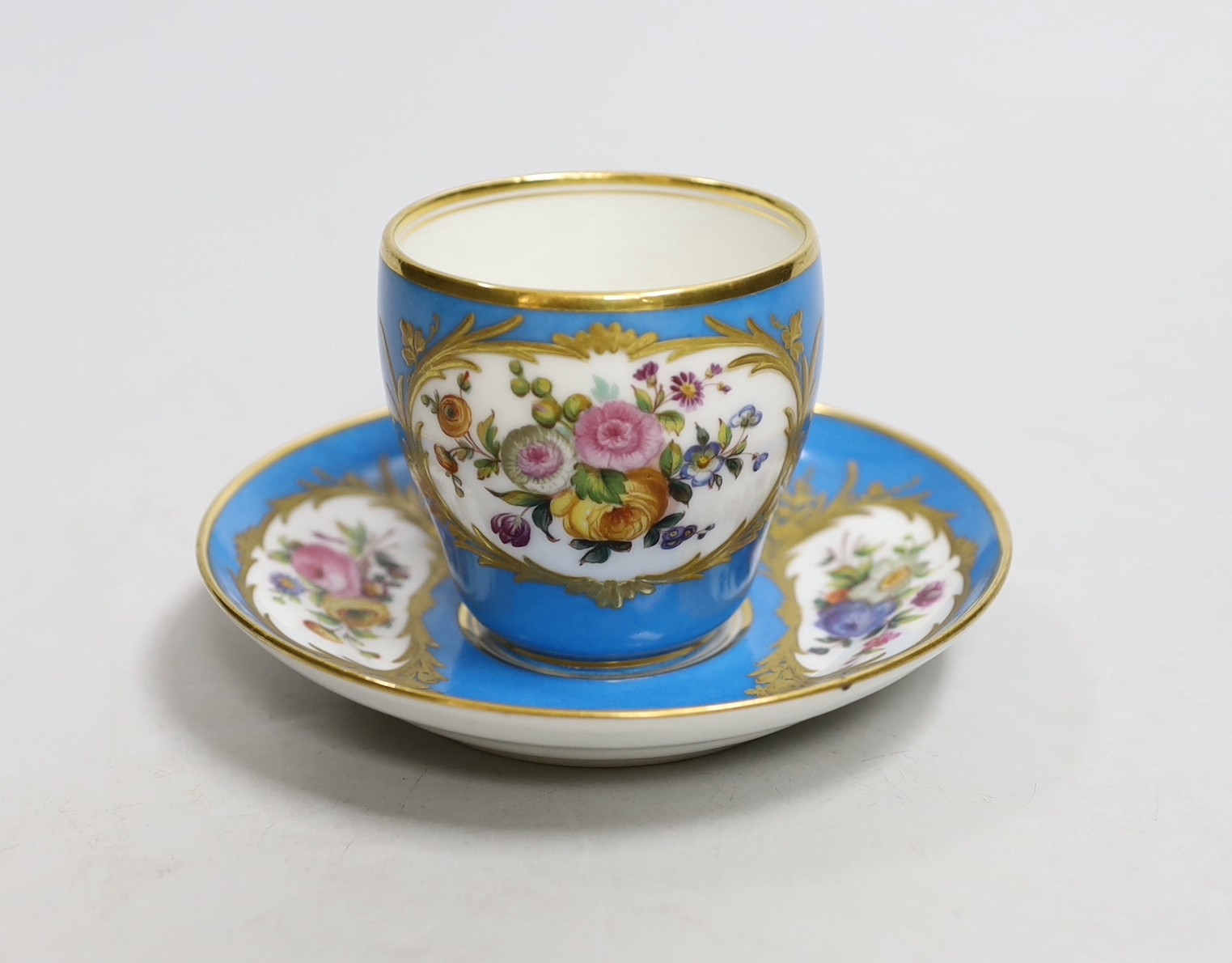 A Paris porcelain Sevres style cup and saucer